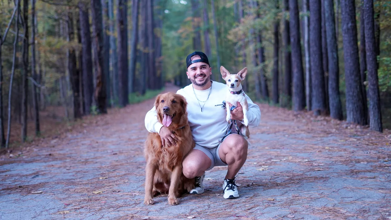 Mario crouched on the trail with Jax at his side and Ella in his arm